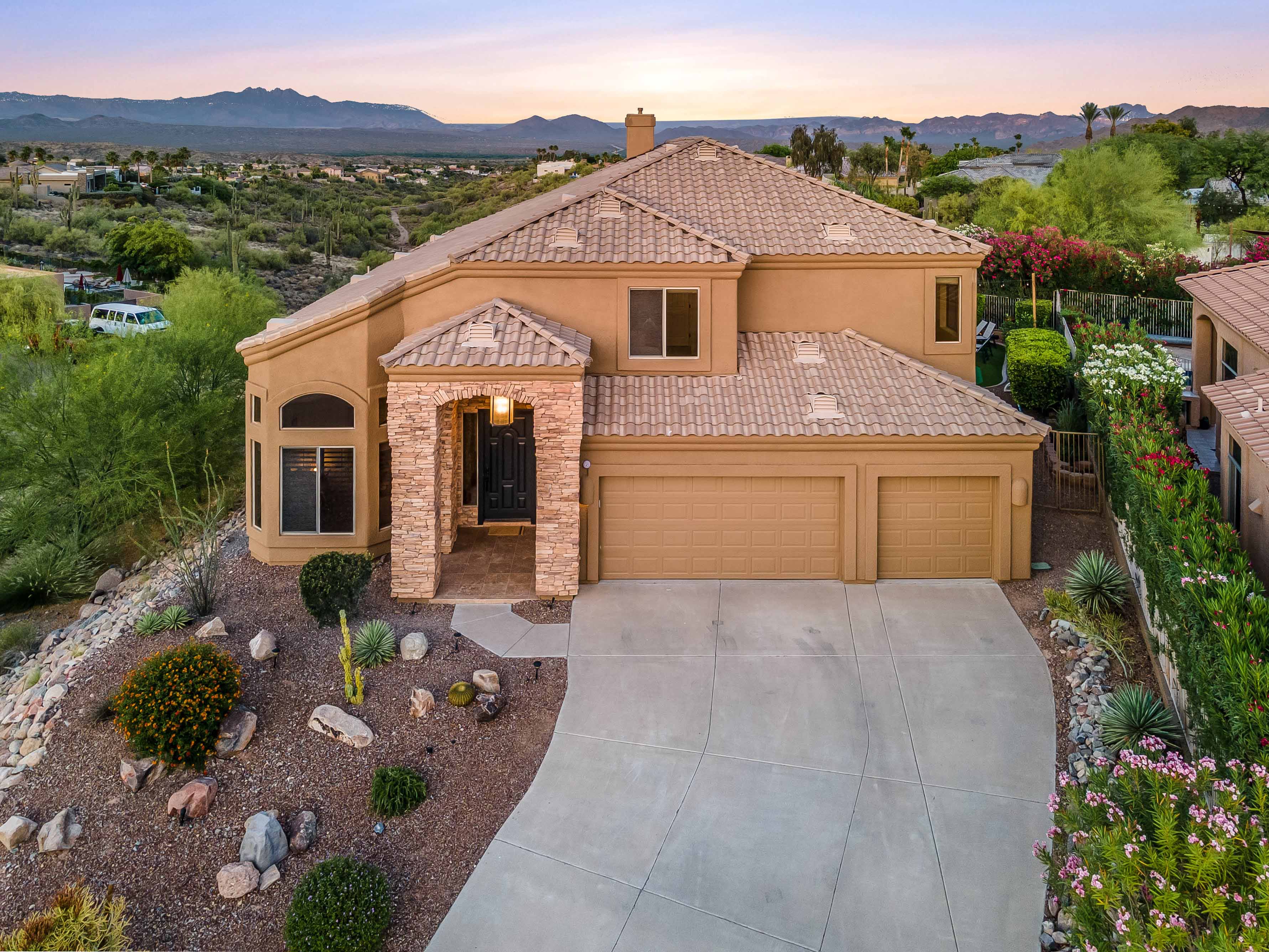 aerial photo of a home with mountains in the background